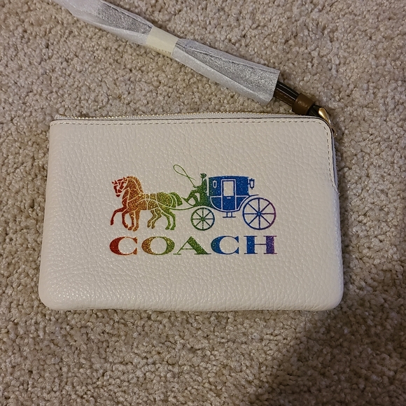 Coach Handbags - COACH Corner zip Wristlet with Horse and Carriage. With rainbow 🌈 colors.